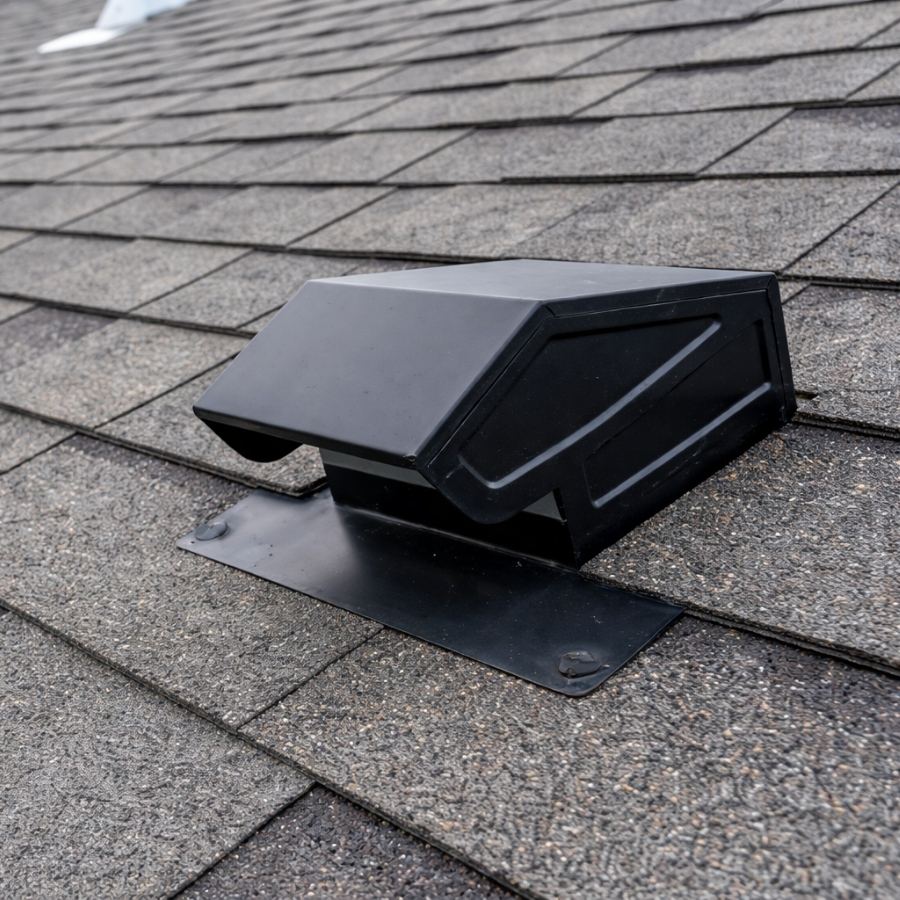 Static vent installed on a shingle roof for passive attic ventilation