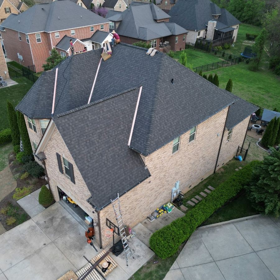 red rover roofing contractors during a roof maintenance